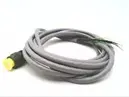 A gray cable with green ends on top of it.