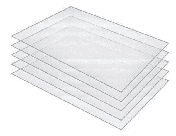 A stack of four clear plastic sheets.