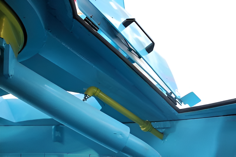 A close up of the side of a blue boat.